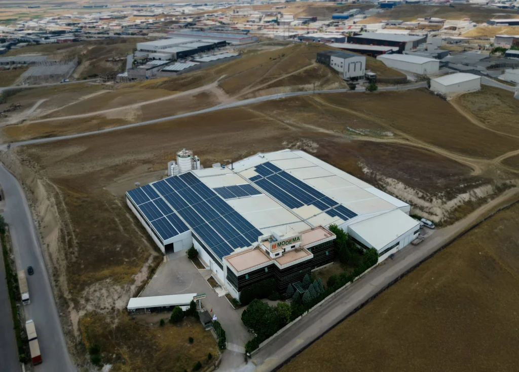 Aerial view of the Modema factory with solar panels on the roof